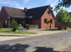 Centraal gelegen riante woning met bouwgrond in Ostrhauderfehn